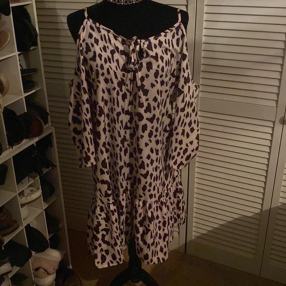 Offwhite and black cheetah print dress. 3/4 length sleeve with cutout.